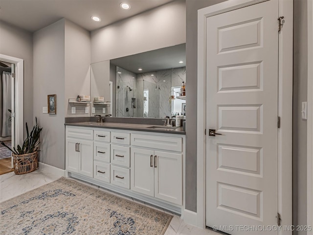 13606 S 21st Pl E, Bixby, OK 74008 - bathroom with marble look tiles, a marble finish shower, double vanity, baseboards, and recessed lighting
