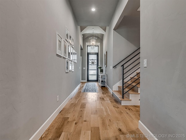 13606 S 21st Pl E, Bixby, OK 74008 - foyer featuring a chandelier, light wood-type flooring, baseboards, and stairway
