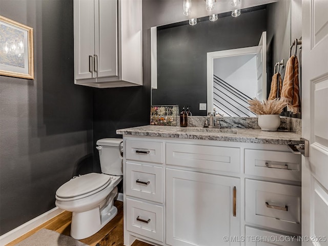 13606 S 21st Pl E, Bixby, OK 74008 - half bathroom featuring toilet, vanity, and wood finished floors