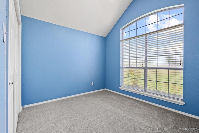 205 Summit, Durant, OK 74701 - empty room with vaulted ceiling, carpet floors, and baseboards