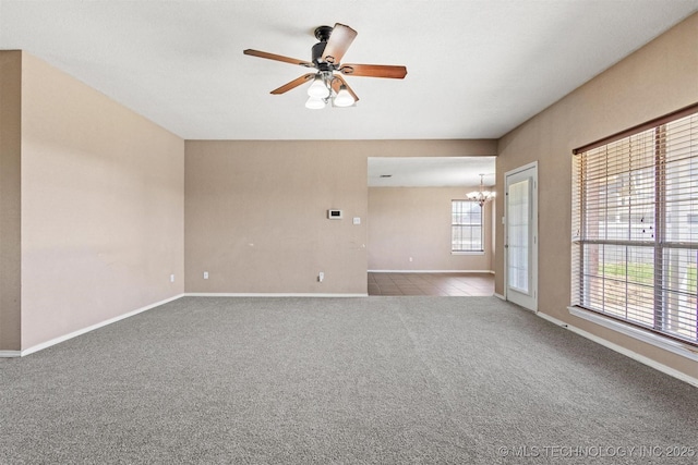 205 Summit, Durant, OK 74701 - empty room featuring a chandelier, plenty of natural light, and carpet floors