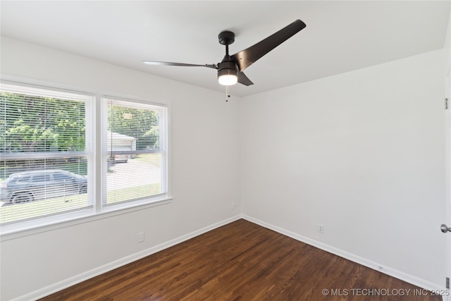 5433 S Boston Ave, Tulsa, OK 74105 - spare room with dark wood-type flooring, ceiling fan, and baseboards