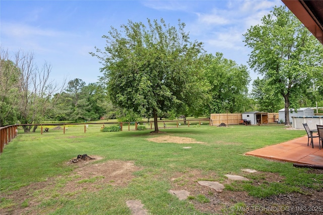 2961 N 24th St W, Muskogee, OK 74401 - fenced backyard featuring a shed, a patio area, and view of scattered trees
