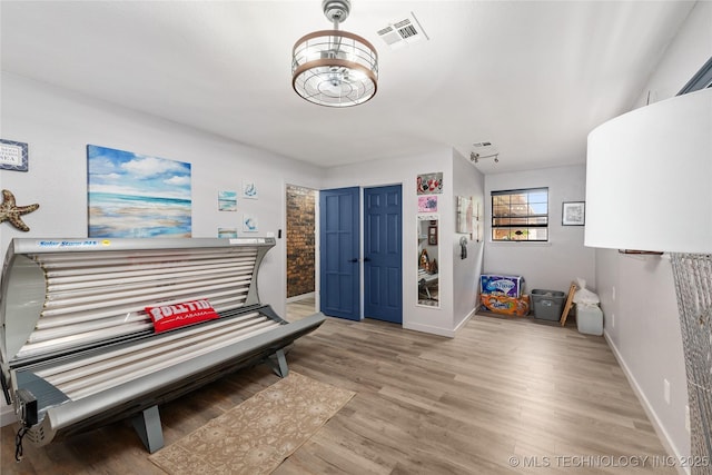 2961 N 24th St W, Muskogee, OK 74401 - foyer with light wood-style floors and a tanning bed
