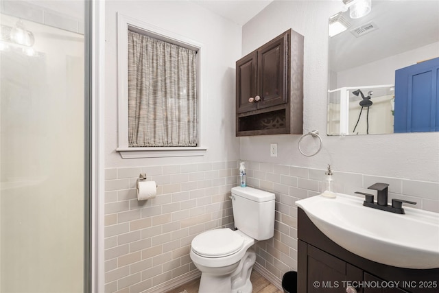 2961 N 24th St W, Muskogee, OK 74401 - full bath with vanity, tile walls, and a shower