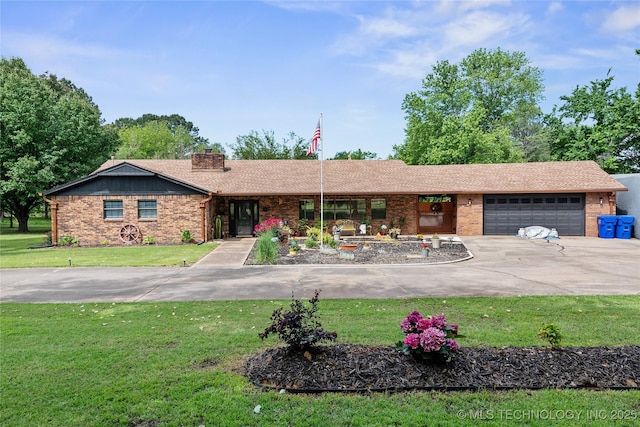 2961 N 24th St W, Muskogee, OK 74401 - ranch-style house featuring brick siding, concrete driveway, a garage, and a front lawn