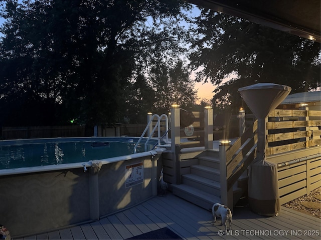 2961 N 24th St W, Muskogee, OK 74401 - pool at dusk with a deck