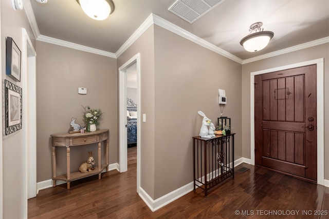 entryway with dark wood-style flooring, ornamental molding, and baseboards