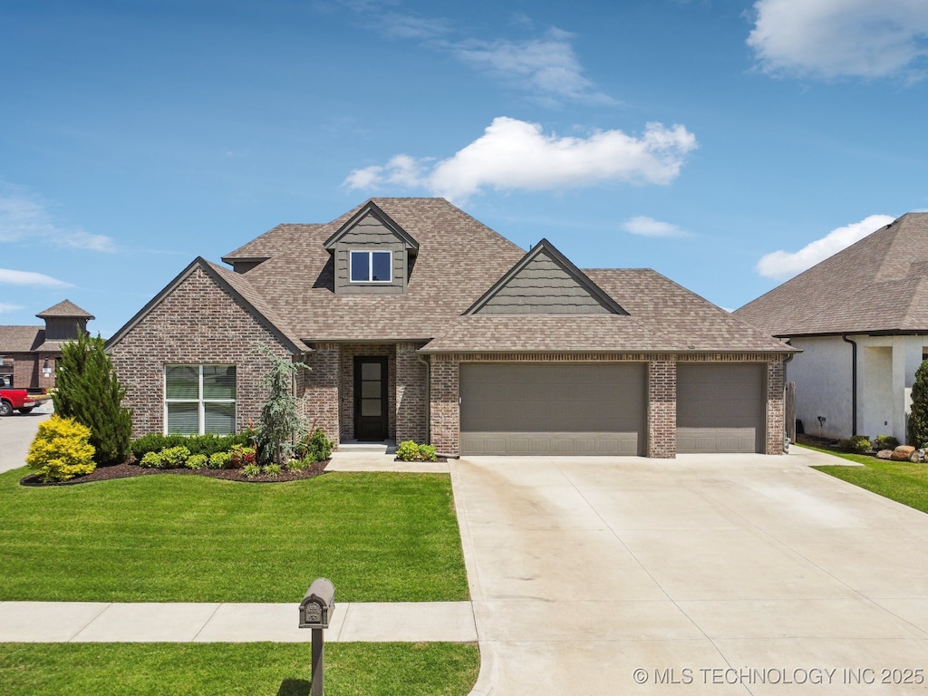 12623 S 73rd Pl, Bixby, OK 74008 - view of front of property with brick siding, a garage, and a front lawn