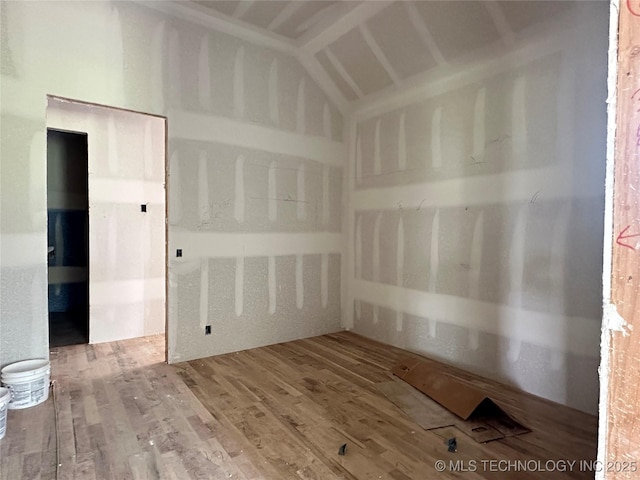 31005 E 67th St S, Broken Arrow, OK 74014 - unfurnished room with vaulted ceiling and wood finished floors