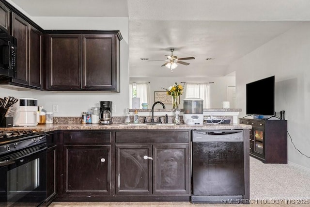 kitchen featuring a sink, black appliances, a peninsula, ceiling fan, and dark brown cabinets
