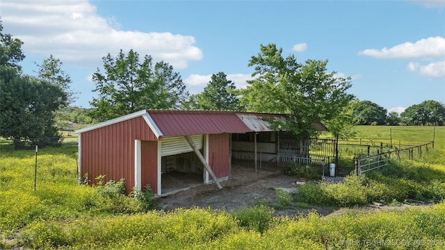 view of pole building featuring fence