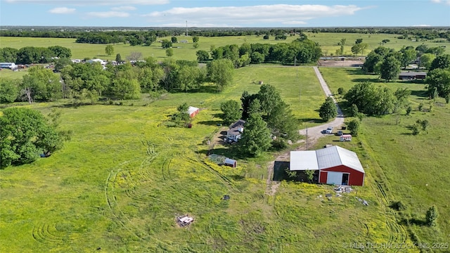 aerial view of property's location with rural landscape, a pastoral area, and a tree filled landscape