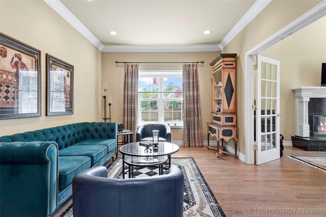 10105 S 72nd E Ave, Tulsa, OK 74133 - living area featuring a premium fireplace, light wood finished floors, crown molding, recessed lighting, and baseboards