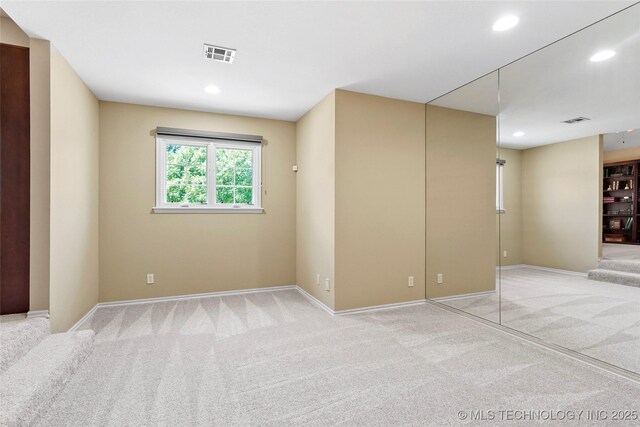 10105 S 72nd E Ave, Tulsa, OK 74133 - spare room with light carpet, baseboards, and recessed lighting