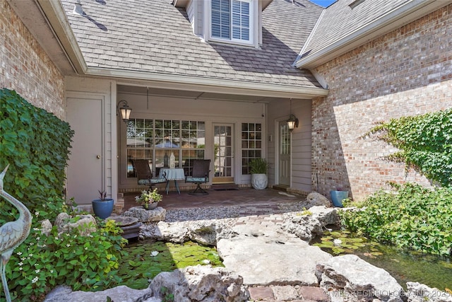 10105 S 72nd E Ave, Tulsa, OK 74133 - doorway to property with brick siding and a patio area