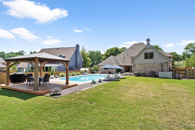 10105 S 72nd E Ave, Tulsa, OK 74133 - view of swimming pool featuring a gazebo, central AC, and a deck