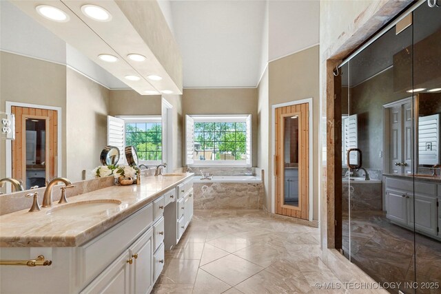 10105 S 72nd E Ave, Tulsa, OK 74133 - full bath with a high ceiling, a garden tub, double vanity, recessed lighting, and marble finish flooring