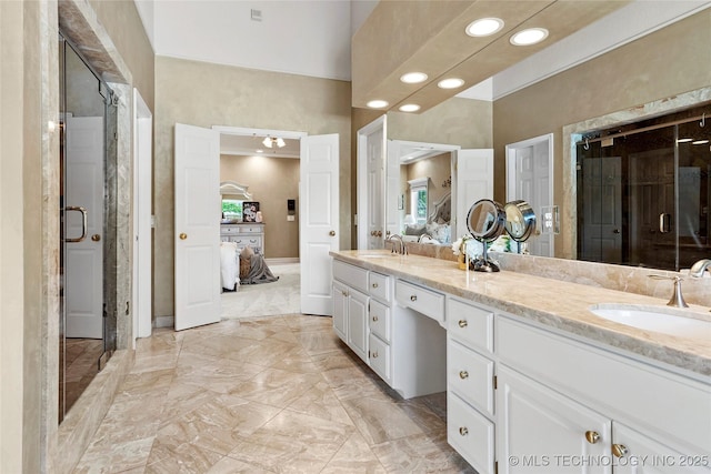 10105 S 72nd E Ave, Tulsa, OK 74133 - bathroom with ensuite bath, double vanity, recessed lighting, a shower stall, and marble finish floors