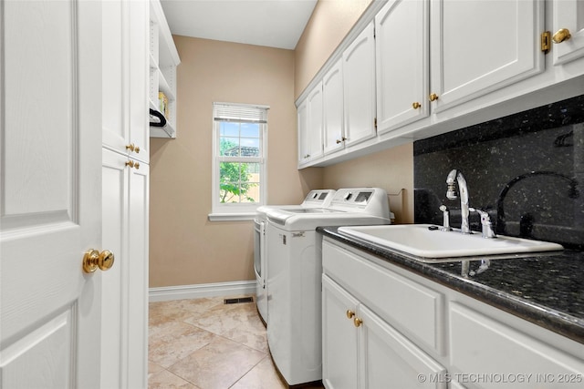 10105 S 72nd E Ave, Tulsa, OK 74133 - laundry area featuring baseboards, independent washer and dryer, and cabinet space