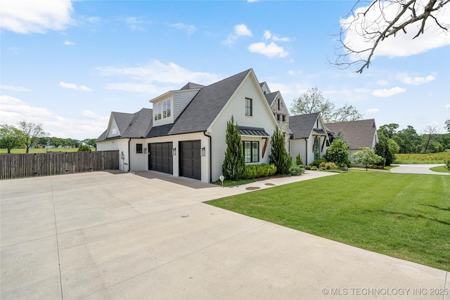 view of front of house featuring driveway, a shingled roof, and a garage