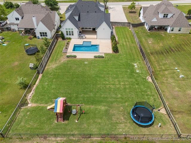 aerial view of property and surrounding area with a pool