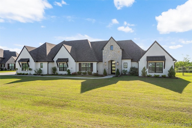 10616 N 81st E Pl, Owasso, OK 74055 - view of front of property with a front yard, stone siding, and stucco siding