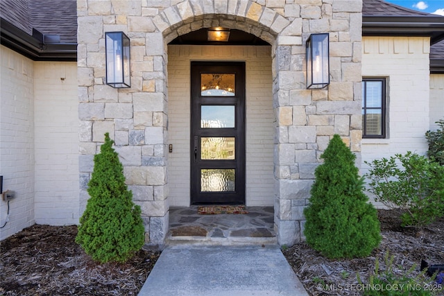 10616 N 81st E Pl, Owasso, OK 74055 - doorway to property with roof with shingles and stone siding