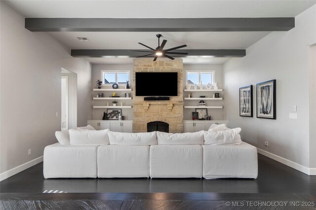 10616 N 81st E Pl, Owasso, OK 74055 - living room featuring ceiling fan, baseboards, beamed ceiling, a stone fireplace, and dark wood finished floors