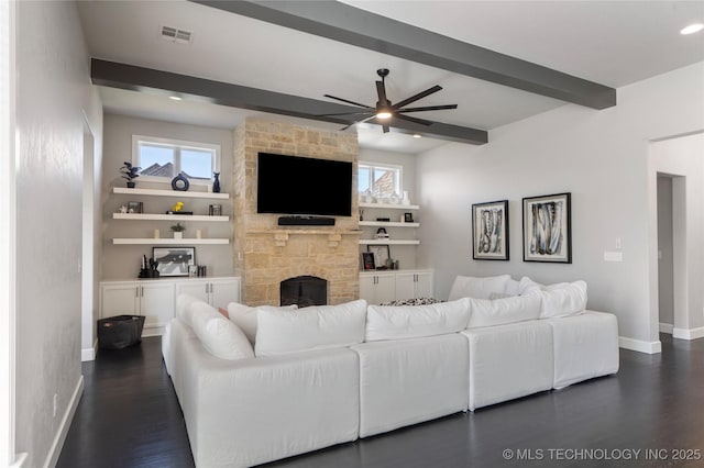 10616 N 81st E Pl, Owasso, OK 74055 - living room with a stone fireplace, dark wood-style flooring, beam ceiling, baseboards, and ceiling fan