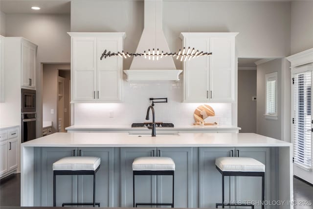 10616 N 81st E Pl, Owasso, OK 74055 - kitchen with tasteful backsplash, appliances with stainless steel finishes, white cabinetry, and recessed lighting