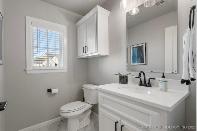 10616 N 81st E Pl, Owasso, OK 74055 - half bath featuring baseboards, marble look tile flooring, toilet, and vanity