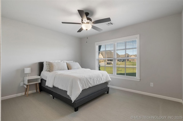 10616 N 81st E Pl, Owasso, OK 74055 - bedroom with baseboards, light carpet, and ceiling fan