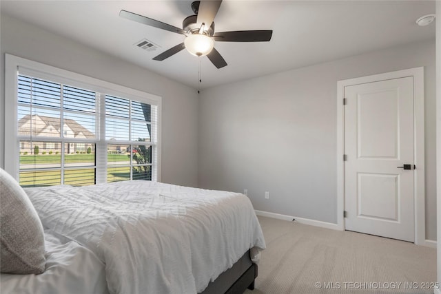 10616 N 81st E Pl, Owasso, OK 74055 - bedroom with baseboards, light colored carpet, and ceiling fan