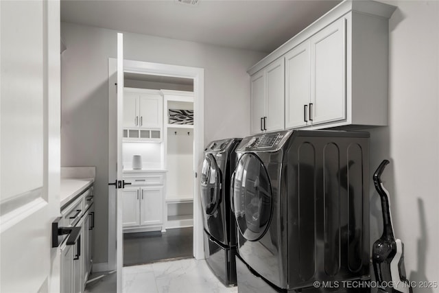 10616 N 81st E Pl, Owasso, OK 74055 - laundry room with washer and dryer, cabinet space, and light marble finish floors