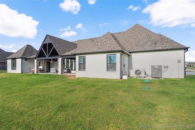 10616 N 81st E Pl, Owasso, OK 74055 - back of house with roof with shingles, central AC unit, a patio area, and brick siding