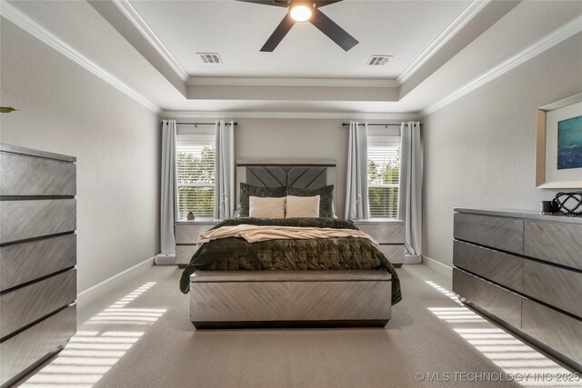 10616 N 81st E Pl, Owasso, OK 74055 - carpeted bedroom with a raised ceiling, multiple windows, baseboards, ornamental molding, and ceiling fan