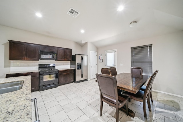 dining area featuring lofted ceiling, recessed lighting, and baseboards
