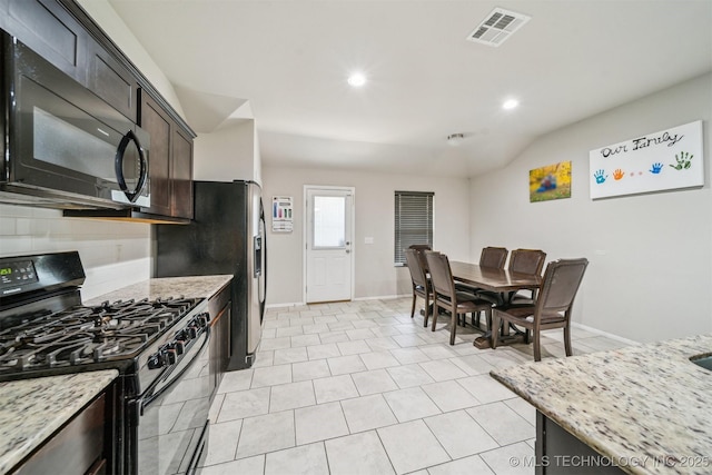 kitchen featuring black appliances, backsplash, baseboards, light stone counters, and recessed lighting