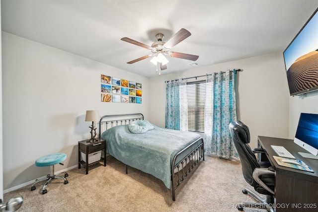 bedroom with carpet flooring, an office area, and ceiling fan