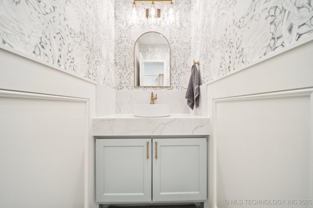 8499 S Timber Wolf Dr, Broken Arrow, OK 74014 - bathroom with vanity and a chandelier