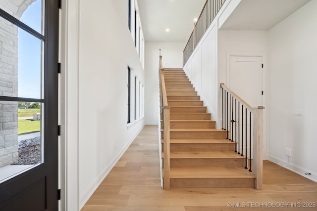 8499 S Timber Wolf Dr, Broken Arrow, OK 74014 - stairs with wood finished floors, recessed lighting, and baseboards