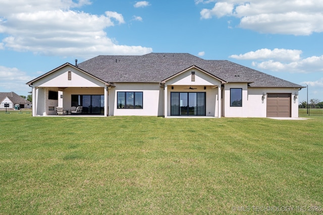 8499 S Timber Wolf Dr, Broken Arrow, OK 74014 - rear view of house featuring a lawn, an attached garage, ceiling fan, and stucco siding