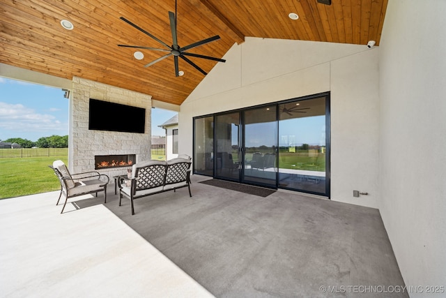 8499 S Timber Wolf Dr, Broken Arrow, OK 74014 - view of patio featuring a ceiling fan and an outdoor living space with a fireplace