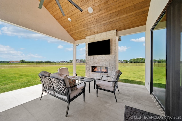 8499 S Timber Wolf Dr, Broken Arrow, OK 74014 - view of patio / terrace with an outdoor living space with a fireplace and ceiling fan