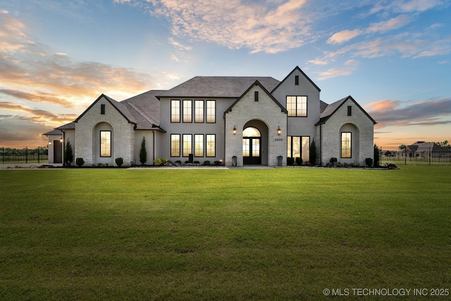 8499 S Timber Wolf Dr, Broken Arrow, OK 74014 - french country style house featuring stone siding and a shingled roof