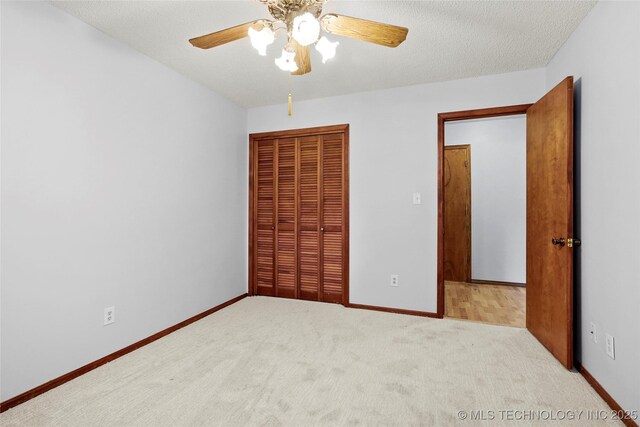8508 E 123rd St S, Bixby, OK 74008 - unfurnished bedroom with a closet, carpet, baseboards, a ceiling fan, and a textured ceiling