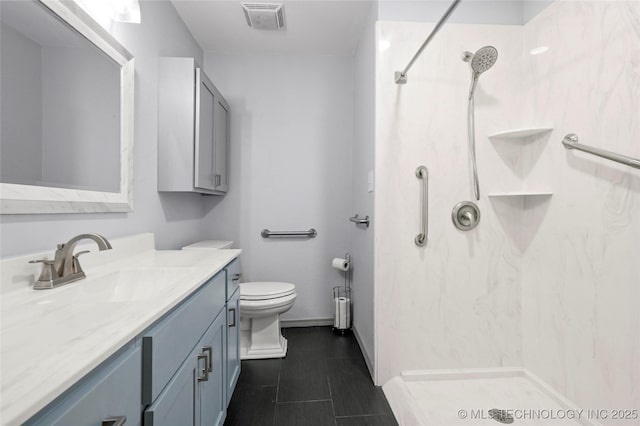 8508 E 123rd St S, Bixby, OK 74008 - full bathroom with a shower, vanity, toilet, and baseboards