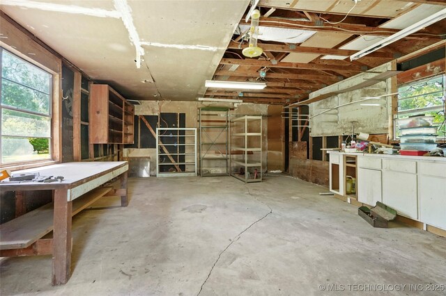 8508 E 123rd St S, Bixby, OK 74008 - misc room with concrete floors and a workshop area