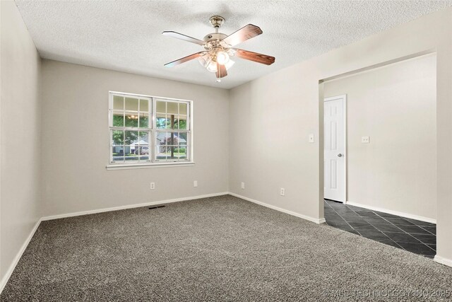 8508 E 123rd St S, Bixby, OK 74008 - spare room featuring dark carpet, a ceiling fan, a textured ceiling, and baseboards